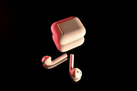 Modern wireless earbuds on a clean surface showing premium design and build quality