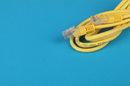 Ethernet cables connected to wireless router showing network setup