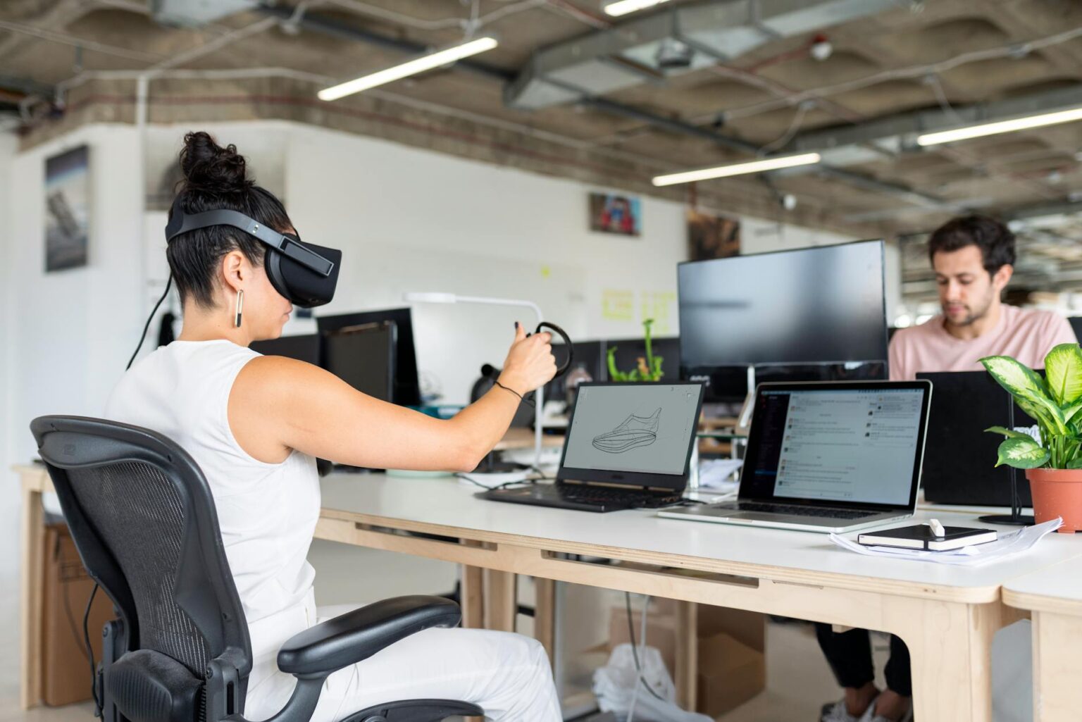 "Professional wearing VR headset in modern office environment for virtual reality work applications"