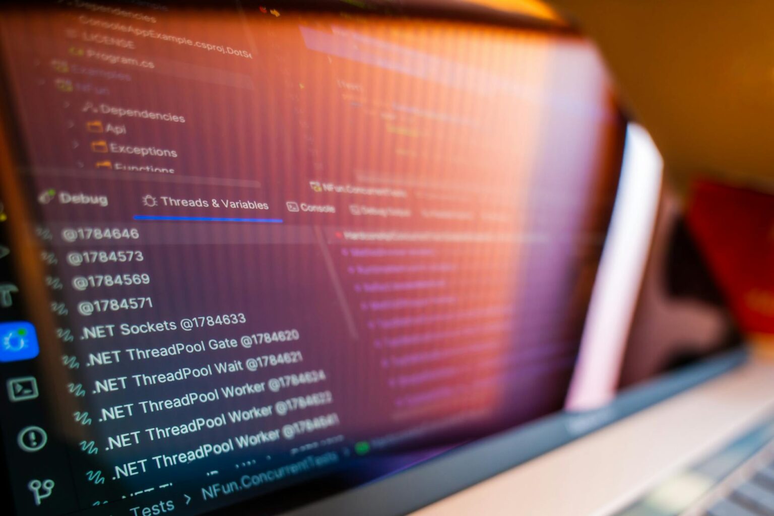 Python code displayed on computer screen showing Discord bot development environment