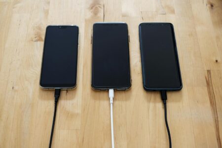Modern smartphone being charged wirelessly on a sleek charging stand