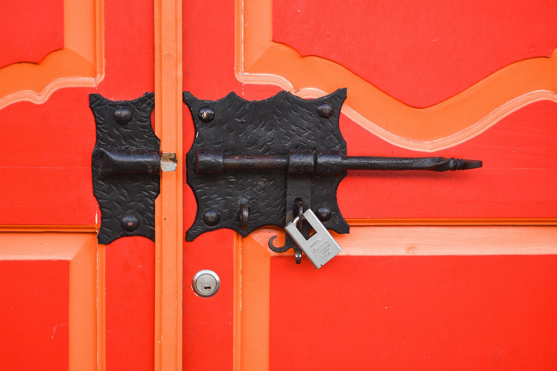 Modern smart door lock with digital keypad installed on residential front door