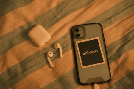 Smartphone charging wirelessly on a modern charging pad