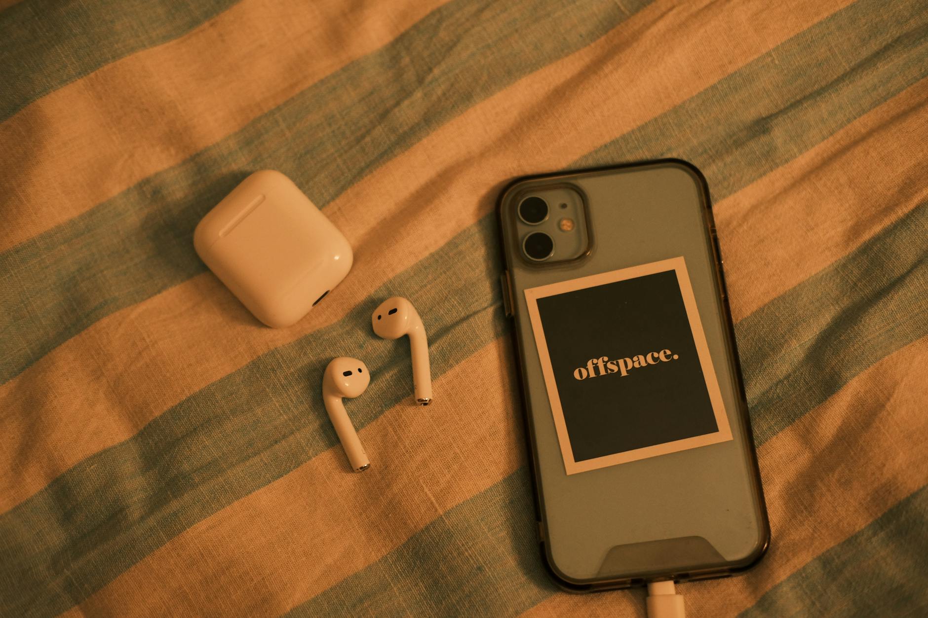 Smartphone charging wirelessly on a modern charging pad