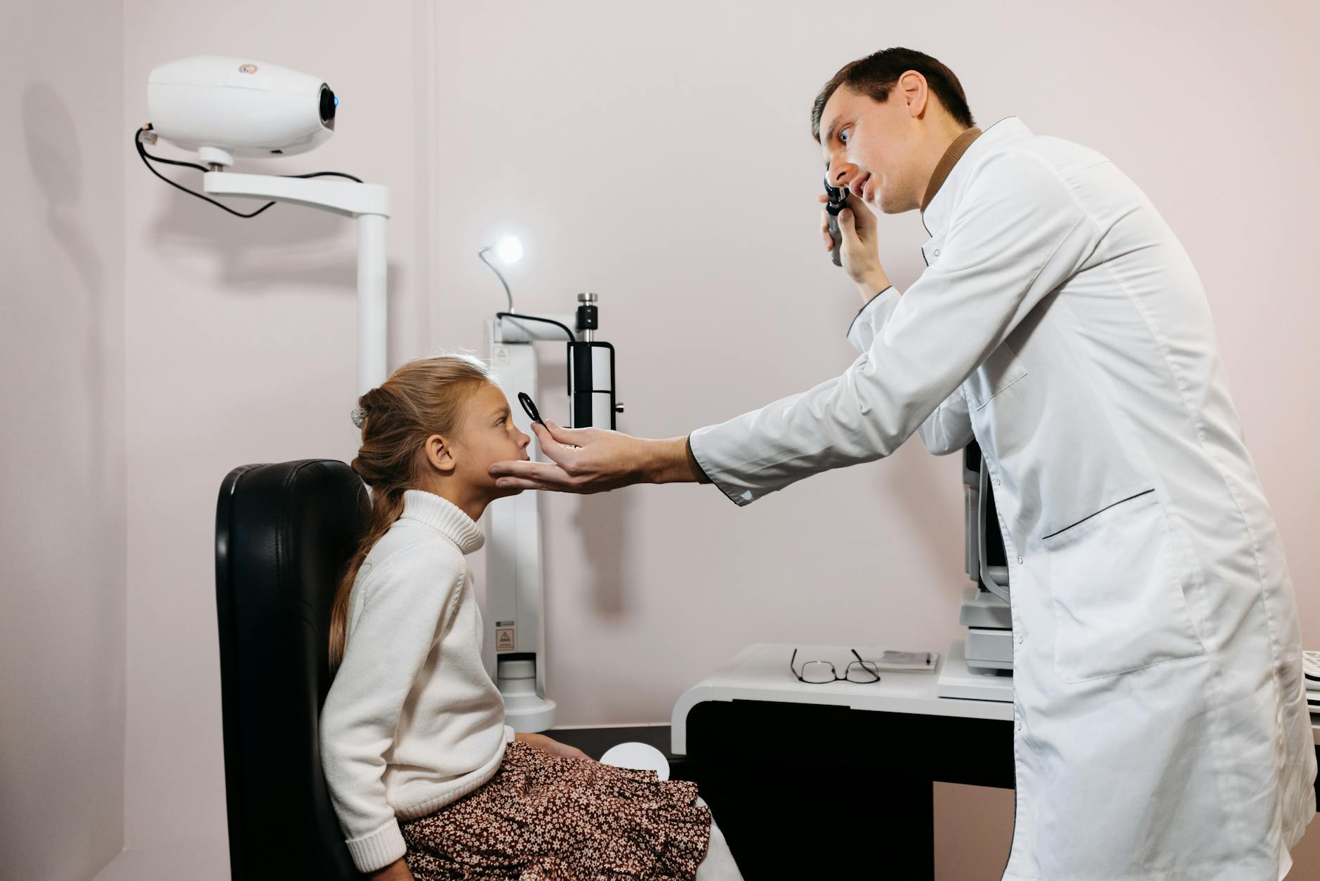 Medical professional conducting an eye examination with specialized equipment for vision and eye health assessment