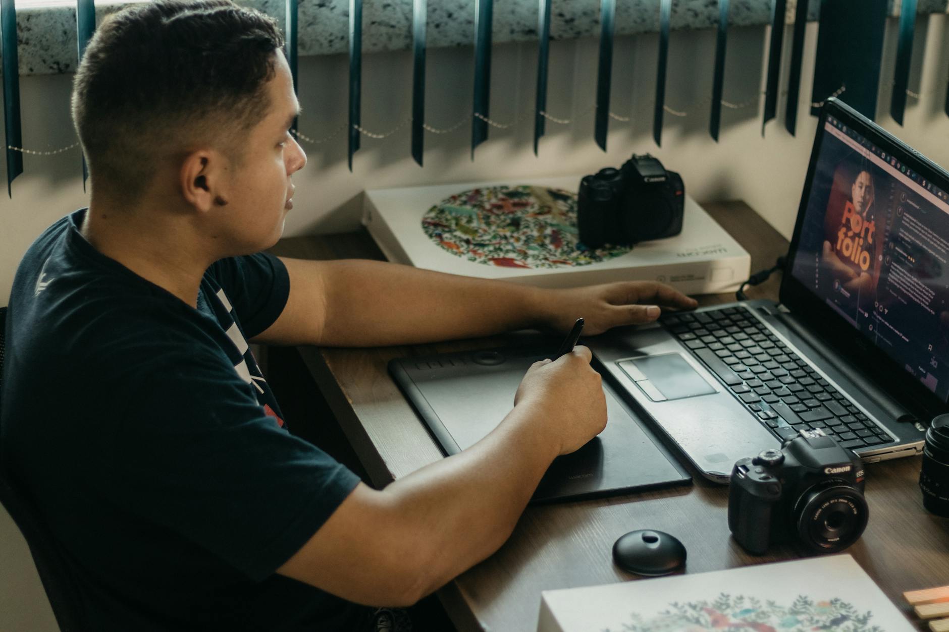 Photographer editing images on computer screen with editing software interface visible