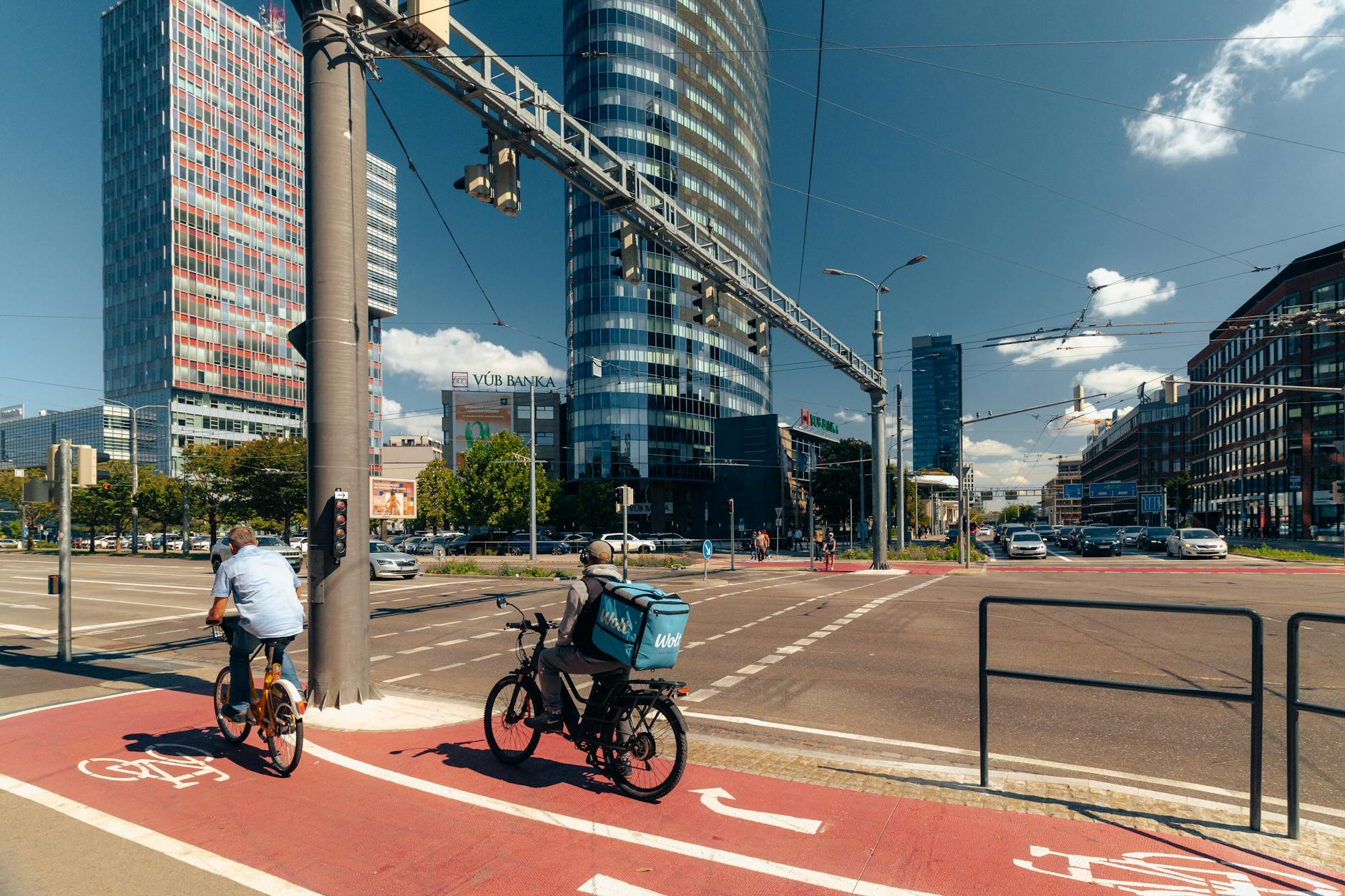 Urban cyclist wearing protective helmet while navigating city streets