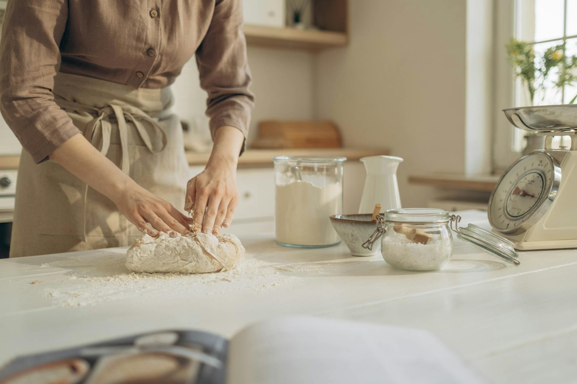 Person weighing fresh ingredients on a smart kitchen scale during meal preparation