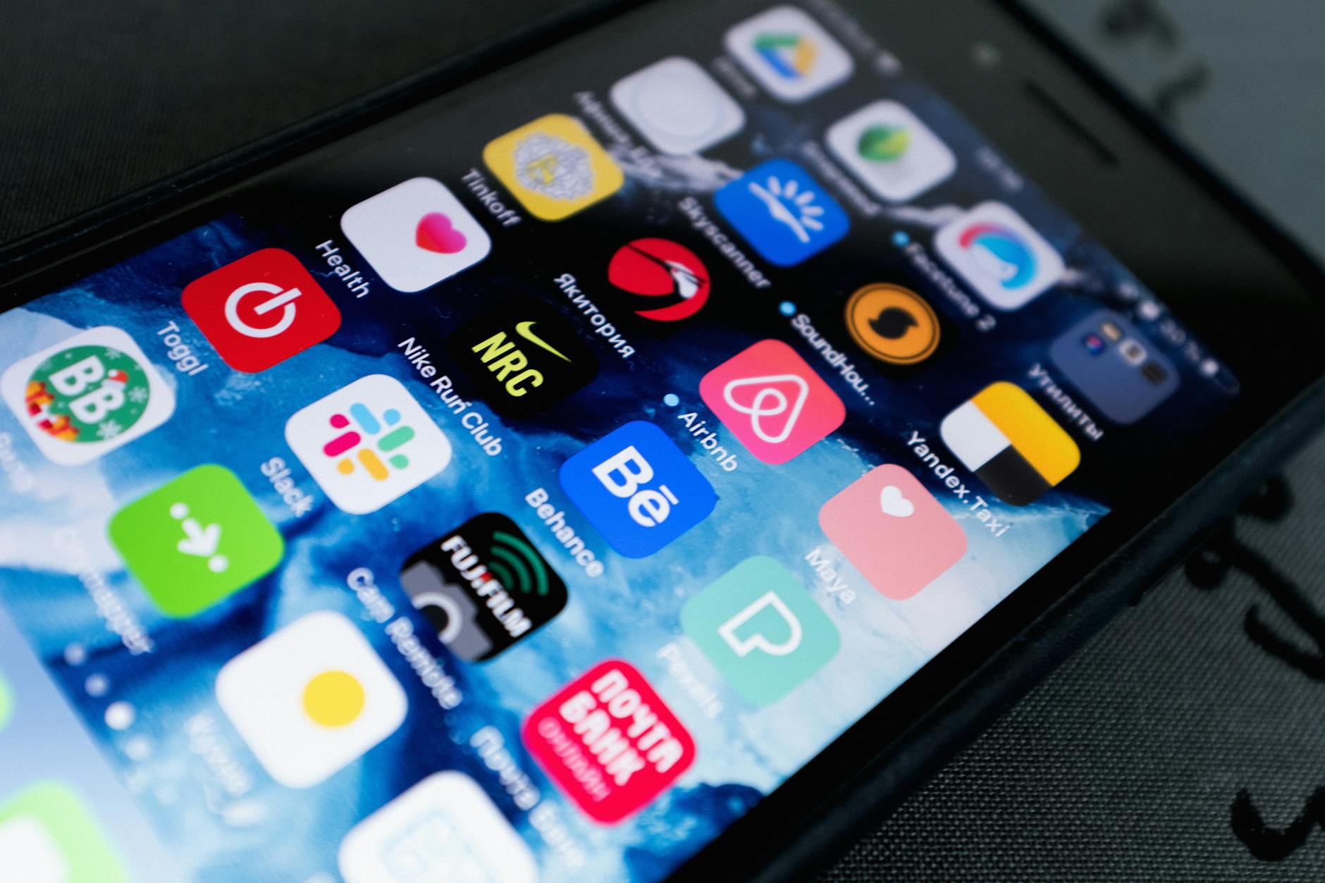 Mobile app wireframe sketches and prototyping interface on desk