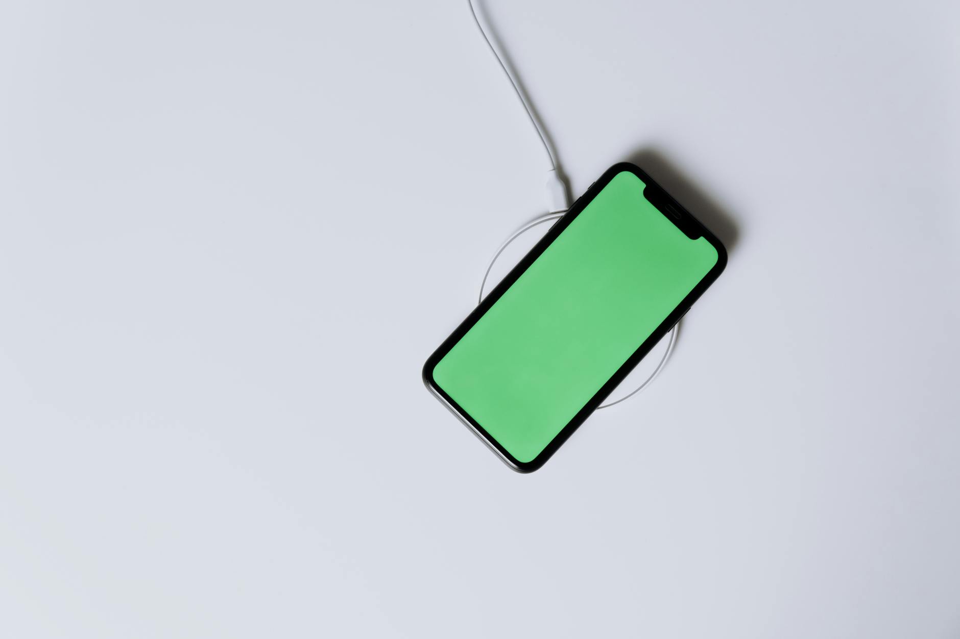 Smartphone connected to fast charging cable demonstrating battery charging capabilities