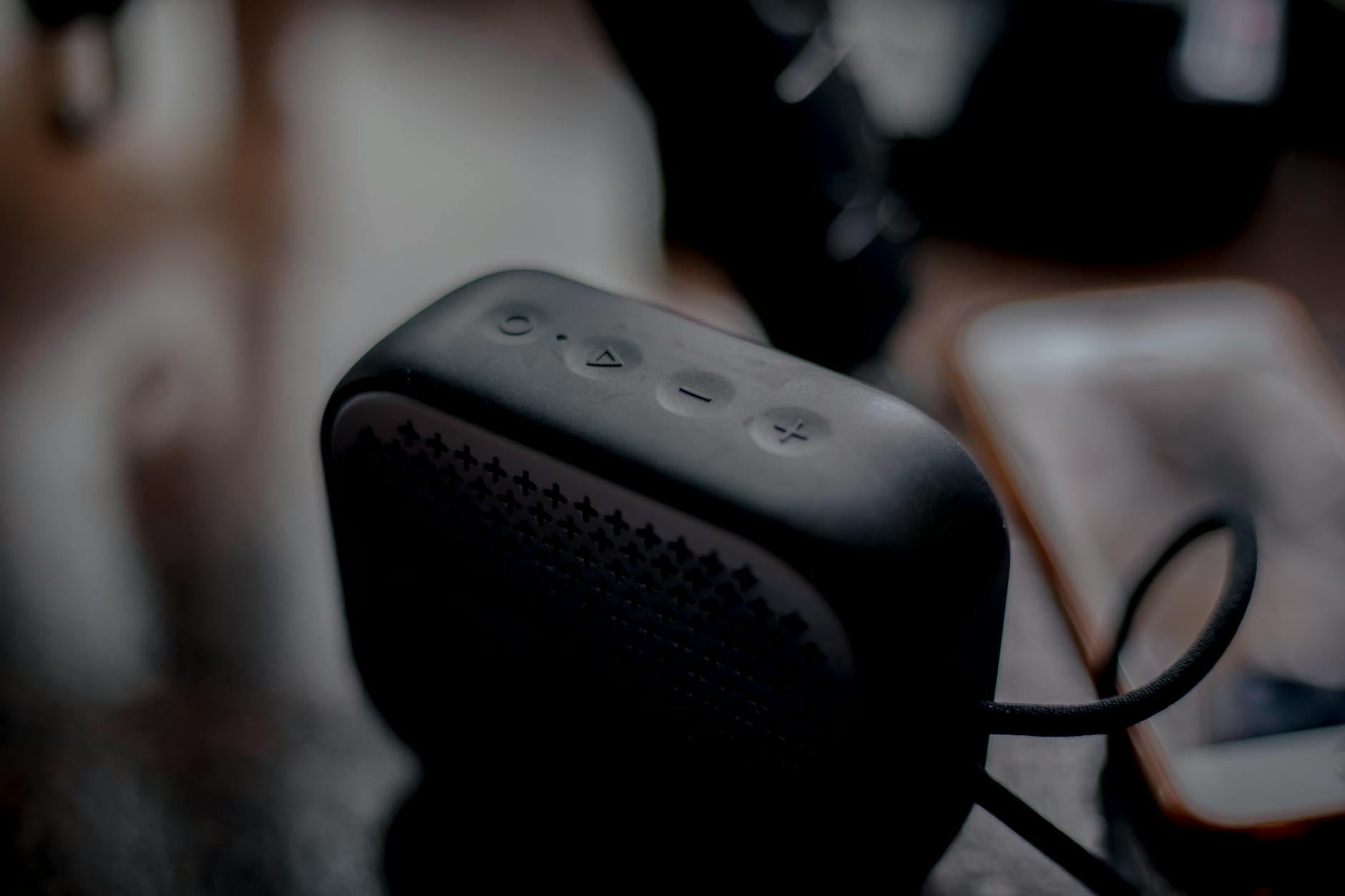 Compact electronic device with cables and connectors on white surface