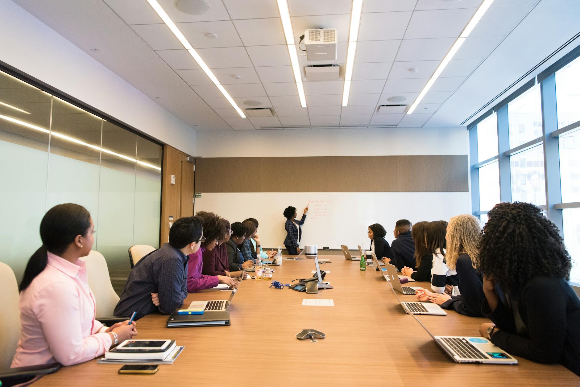 Business professionals reviewing data visualizations during a meeting presentation