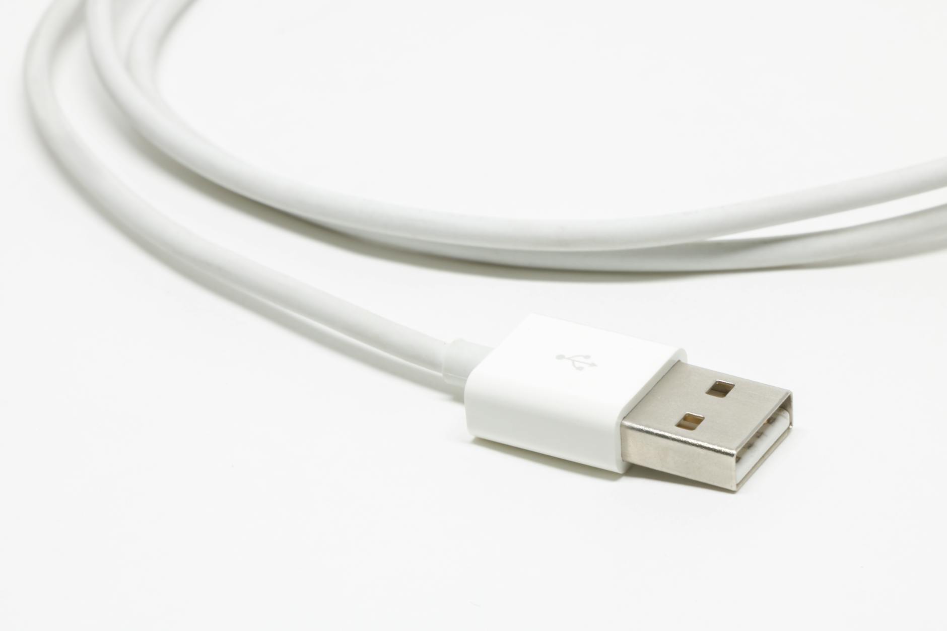 USB-C charging cable connected to premium headphones showing modern charging technology