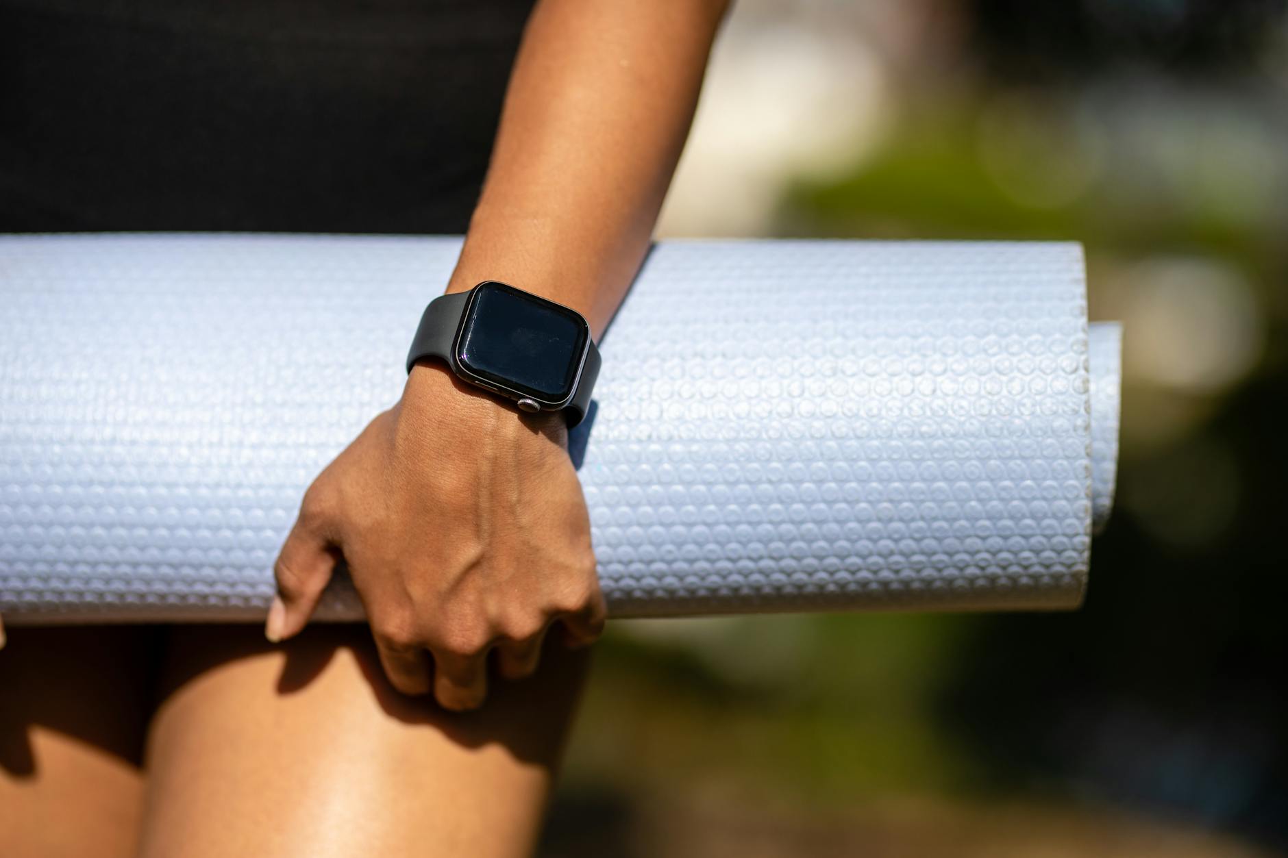Collection of modern fitness wearables and health monitoring devices on a clean surface