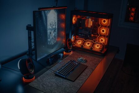 Modern computer workstation with multiple monitors displaying 3D animation software interface