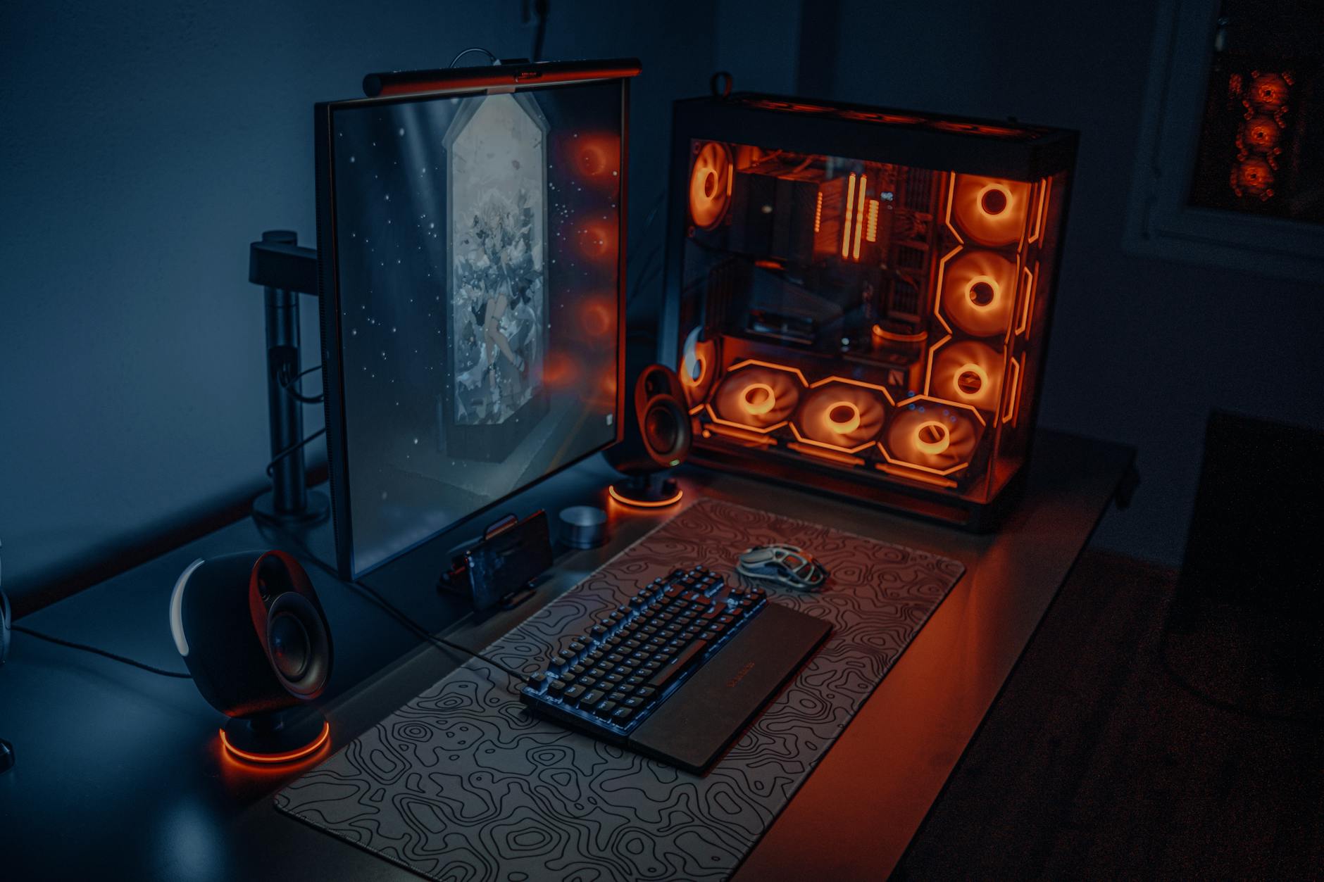 Modern computer workstation with multiple monitors displaying 3D animation software interface