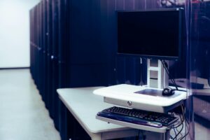 Modern server rack in datacenter with networking equipment and cables