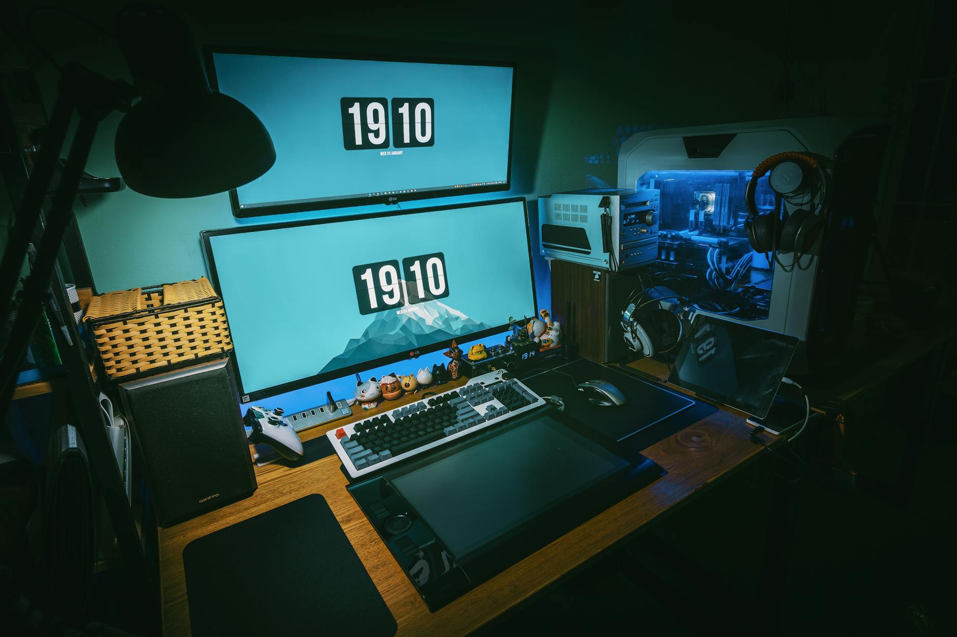 Modern computer workstation running Linux desktop environment with multiple monitors