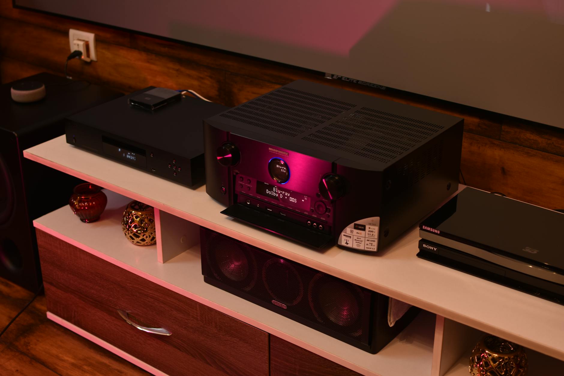 Close-up of a premium wireless speaker system in a clean interior setting