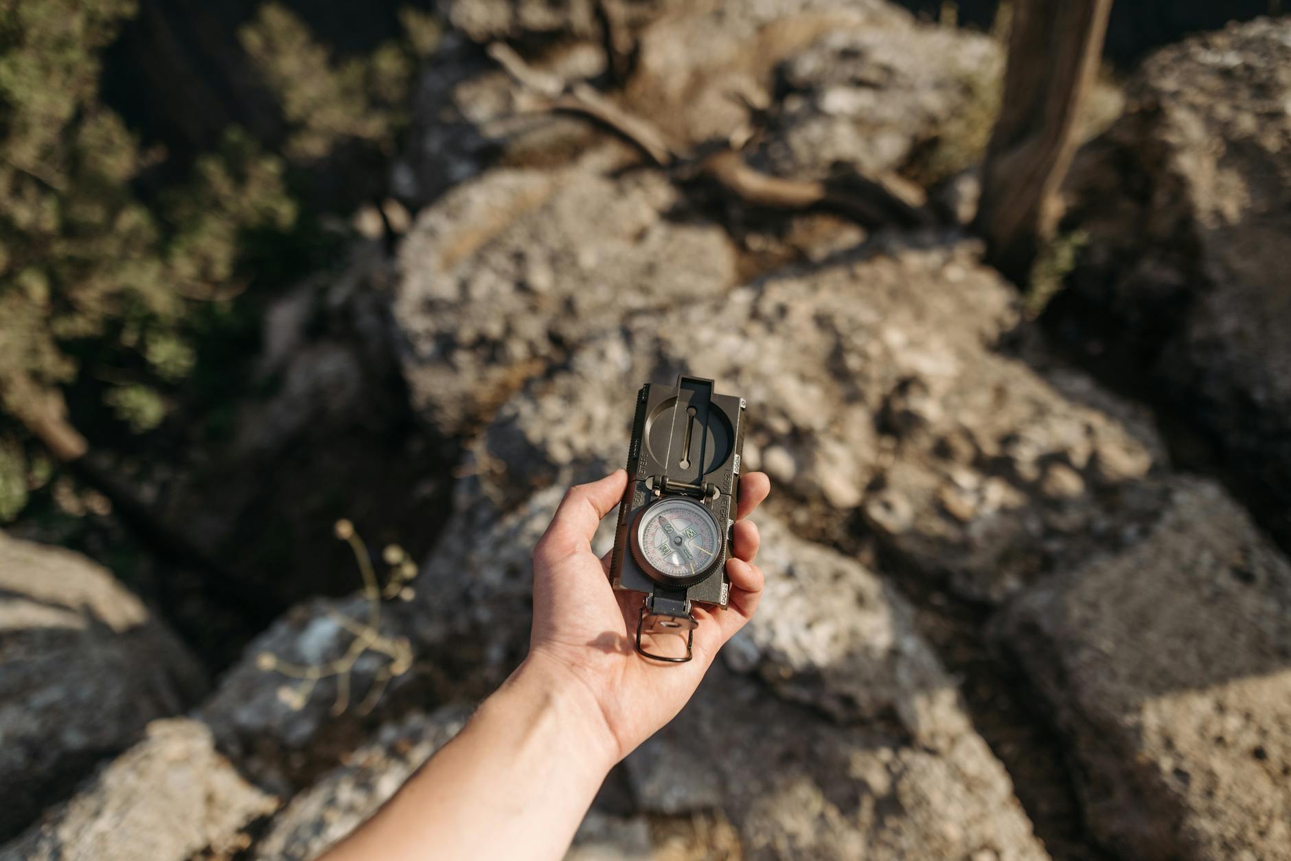 Hiker wearing a rugged smartwatch on a mountain trail