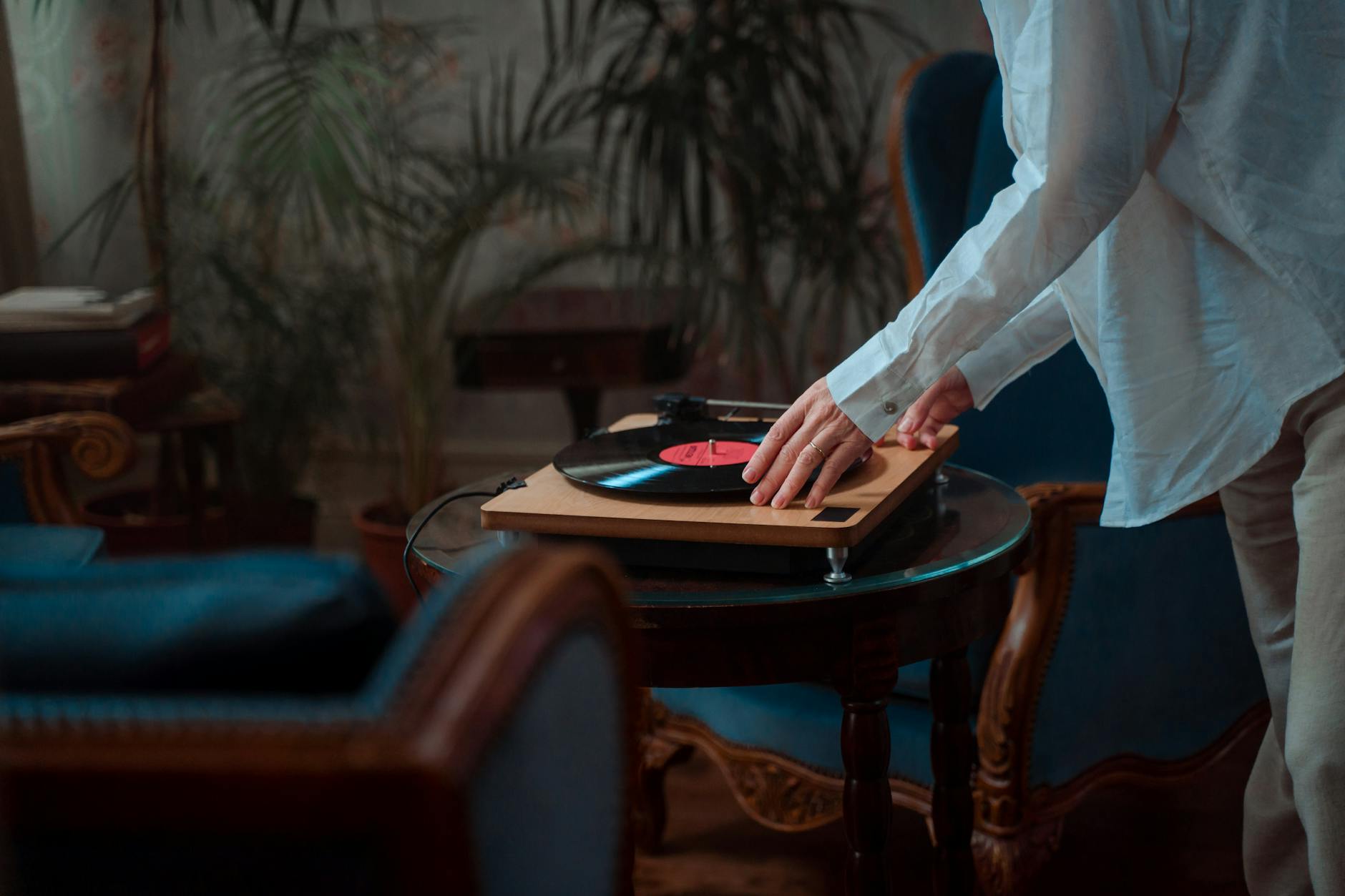 A dedicated listening room with stereo speakers and minimal furniture