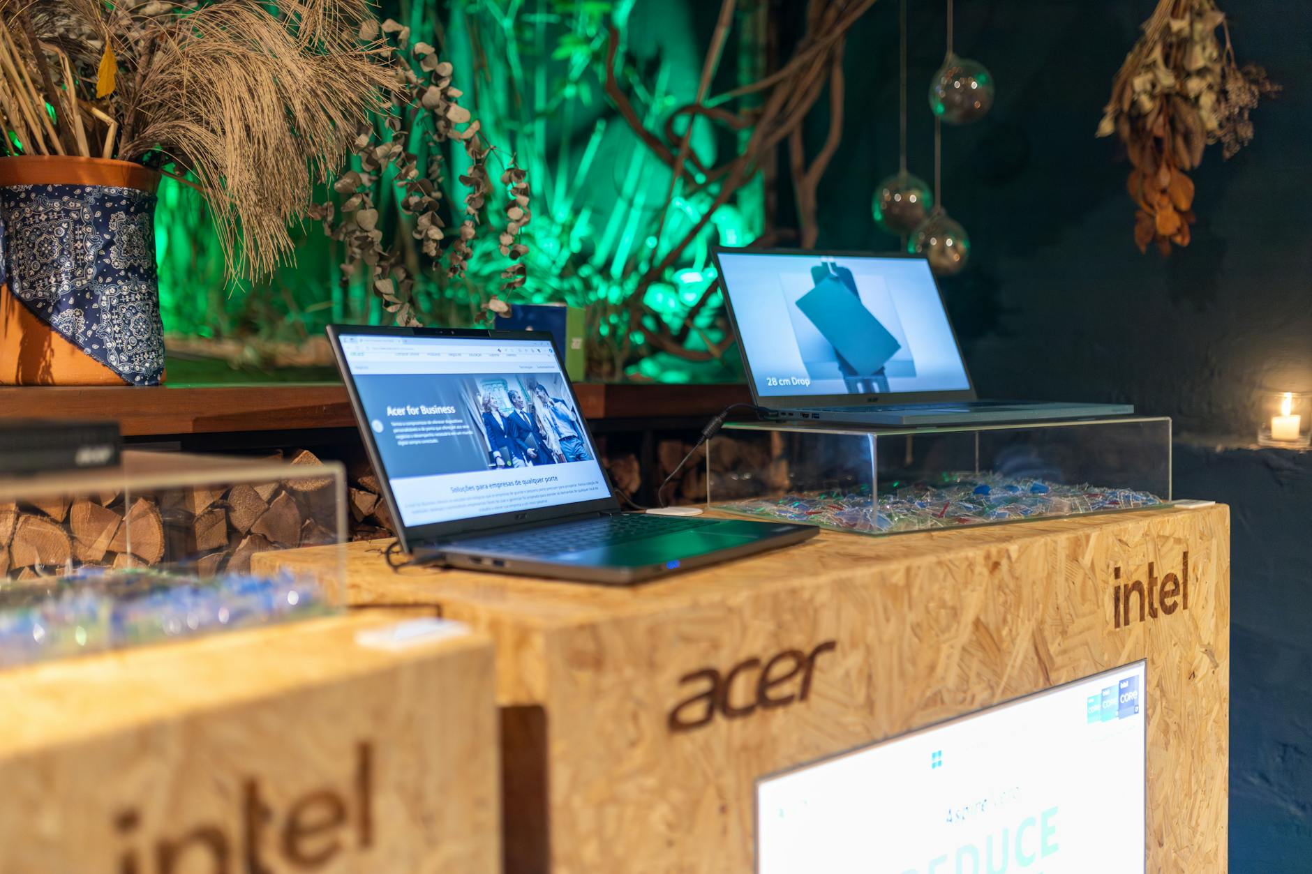 Two laptops side by side on a table for comparison