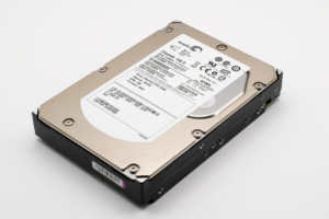 Set Up Scrutiny for Self-Hosted Hard Drive Health Monitoring Multiple hard drives installed in a server rack showing storage hardware