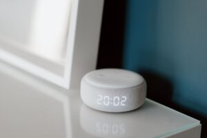Set Up Home Assistant Voice Assistant Without Cloud Dependency A collection of smart home devices arranged on a desk representing local home automation setup