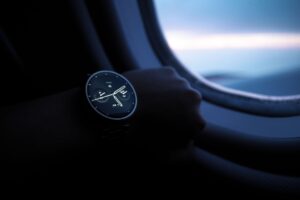 Garmin Fenix 8 vs Apple Watch Ultra 2: Best Rugged Smartwatch Close-up of a rugged smartwatch with titanium case on a rocky outdoor surface