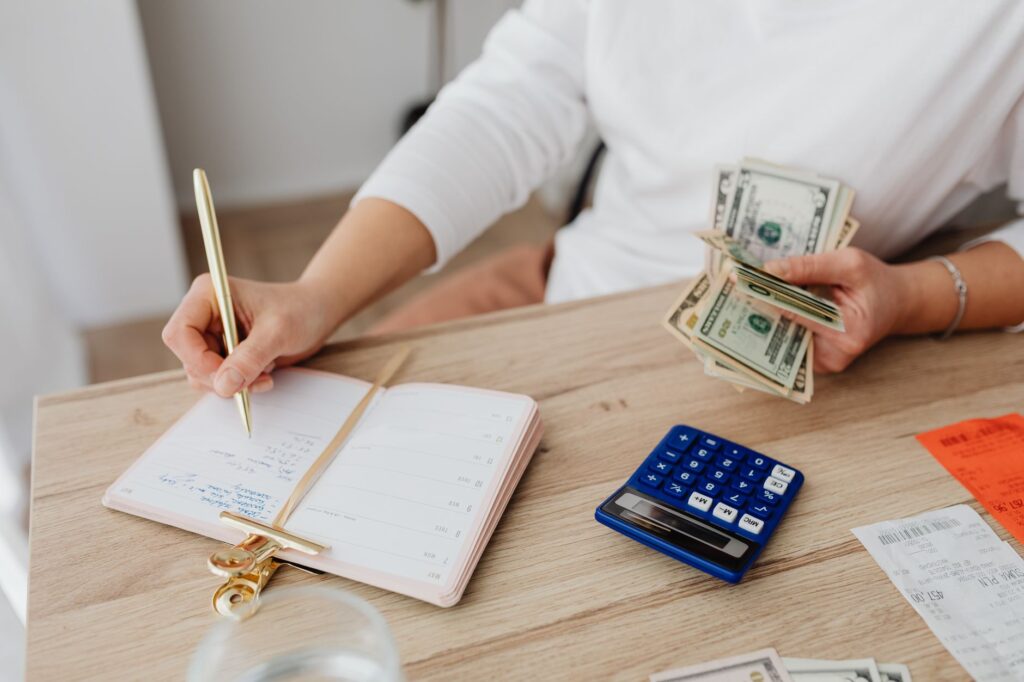Open notebook and pen on a desk used for personal budget planning
