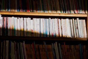 A shelf of organized comic books representing a personal comic library collection