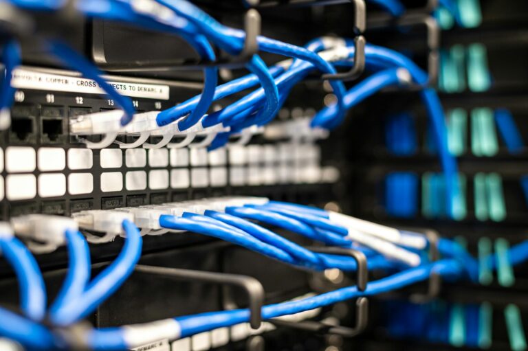 Set Up Radarr and Sonarr for Automated Media Downloading A compact home server setup with networking equipment and a small form-factor PC