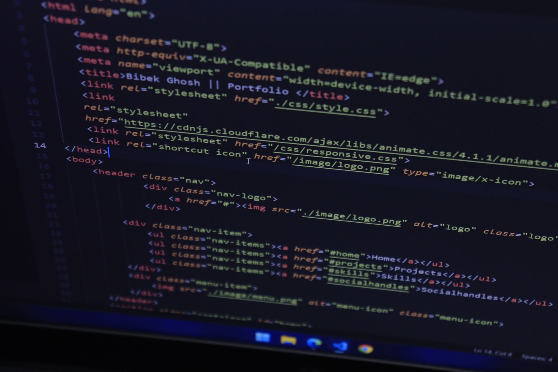 A laptop screen displaying a JSON configuration file in a code editor