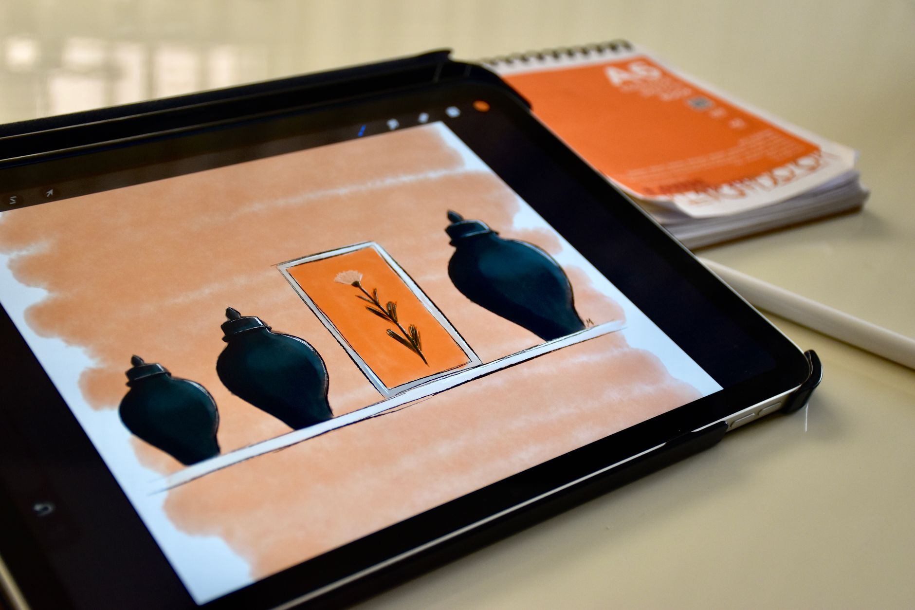 Close-up of a stylus pen being used on a digital writing tablet screen