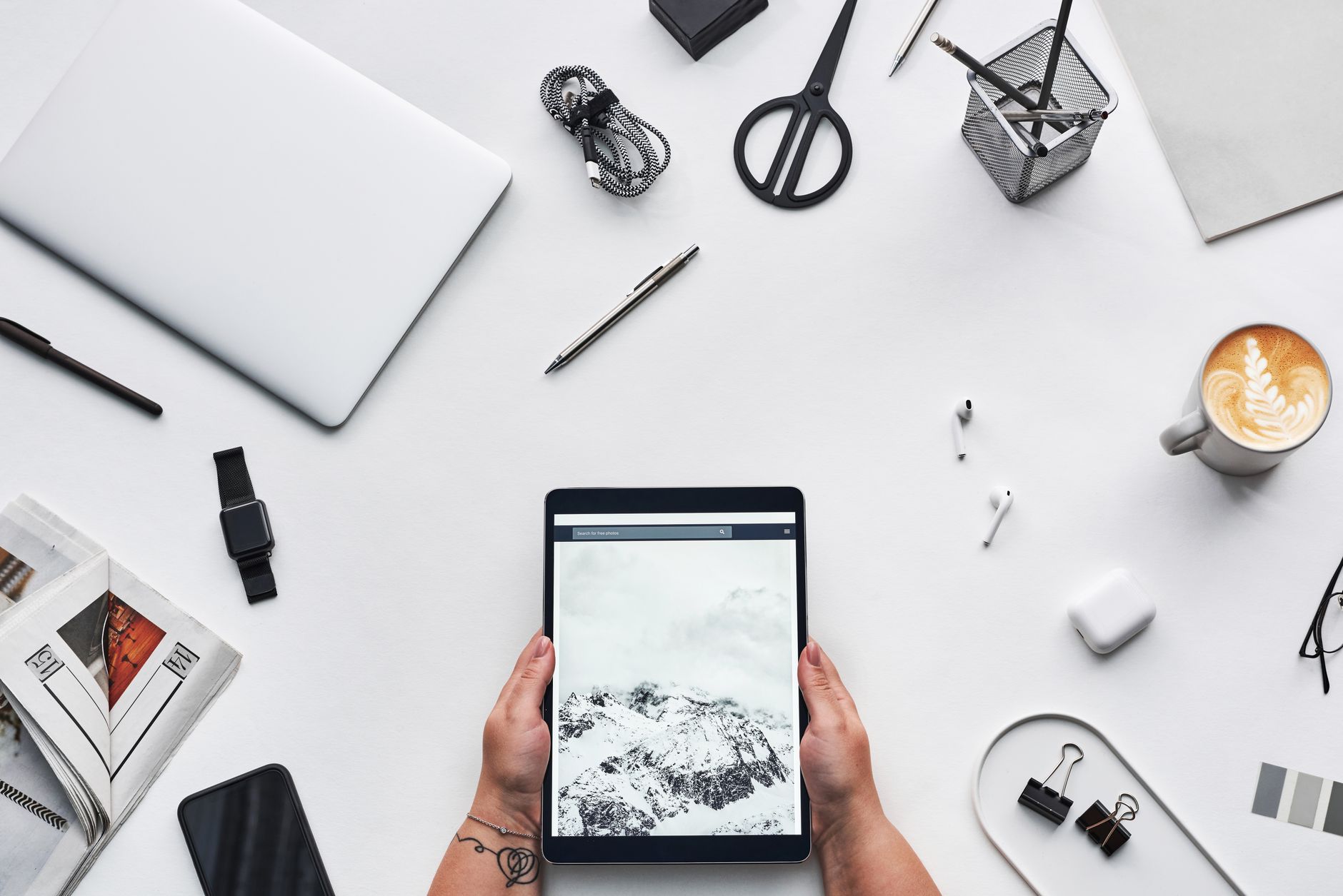 E-ink tablet and stylus placed on a clean modern desk workspace