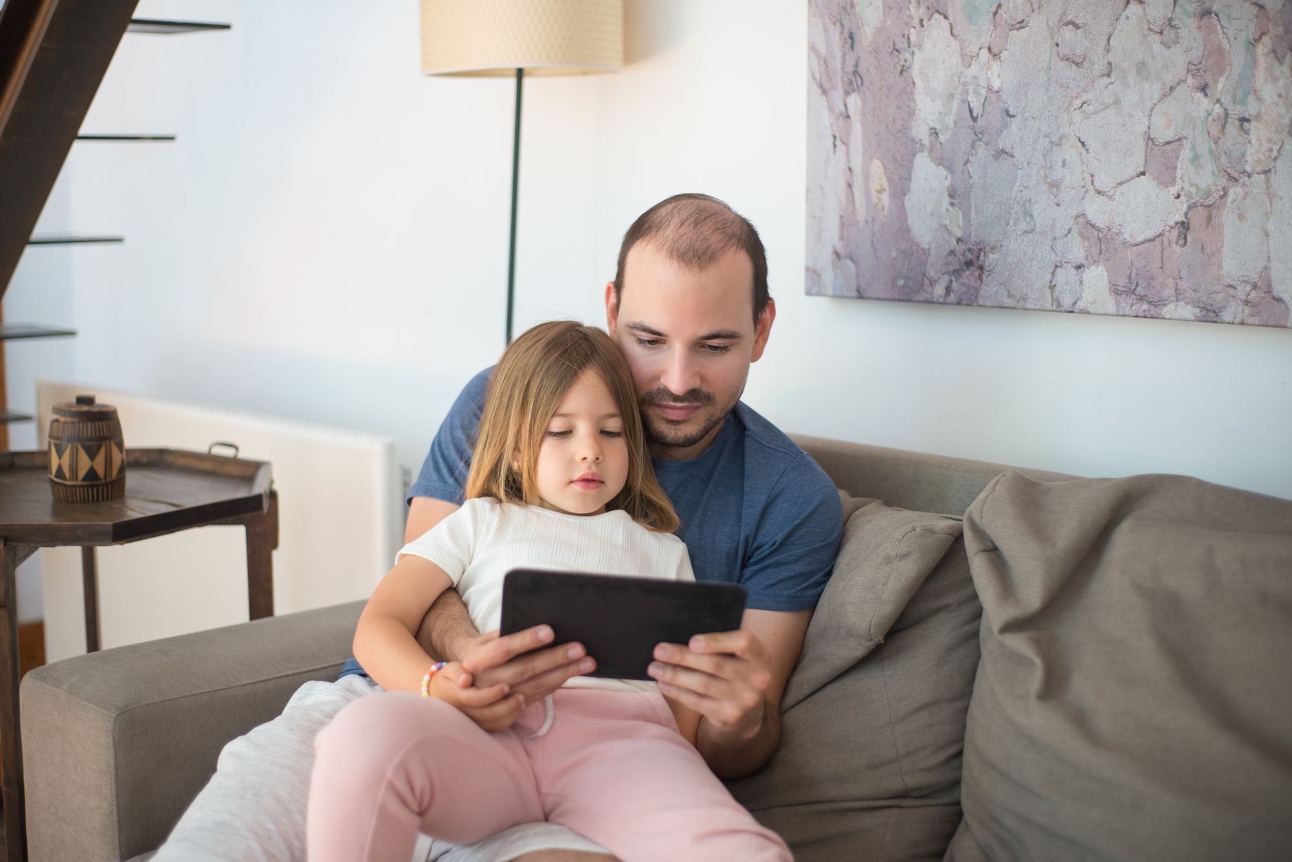 Person reading news articles on a tablet device