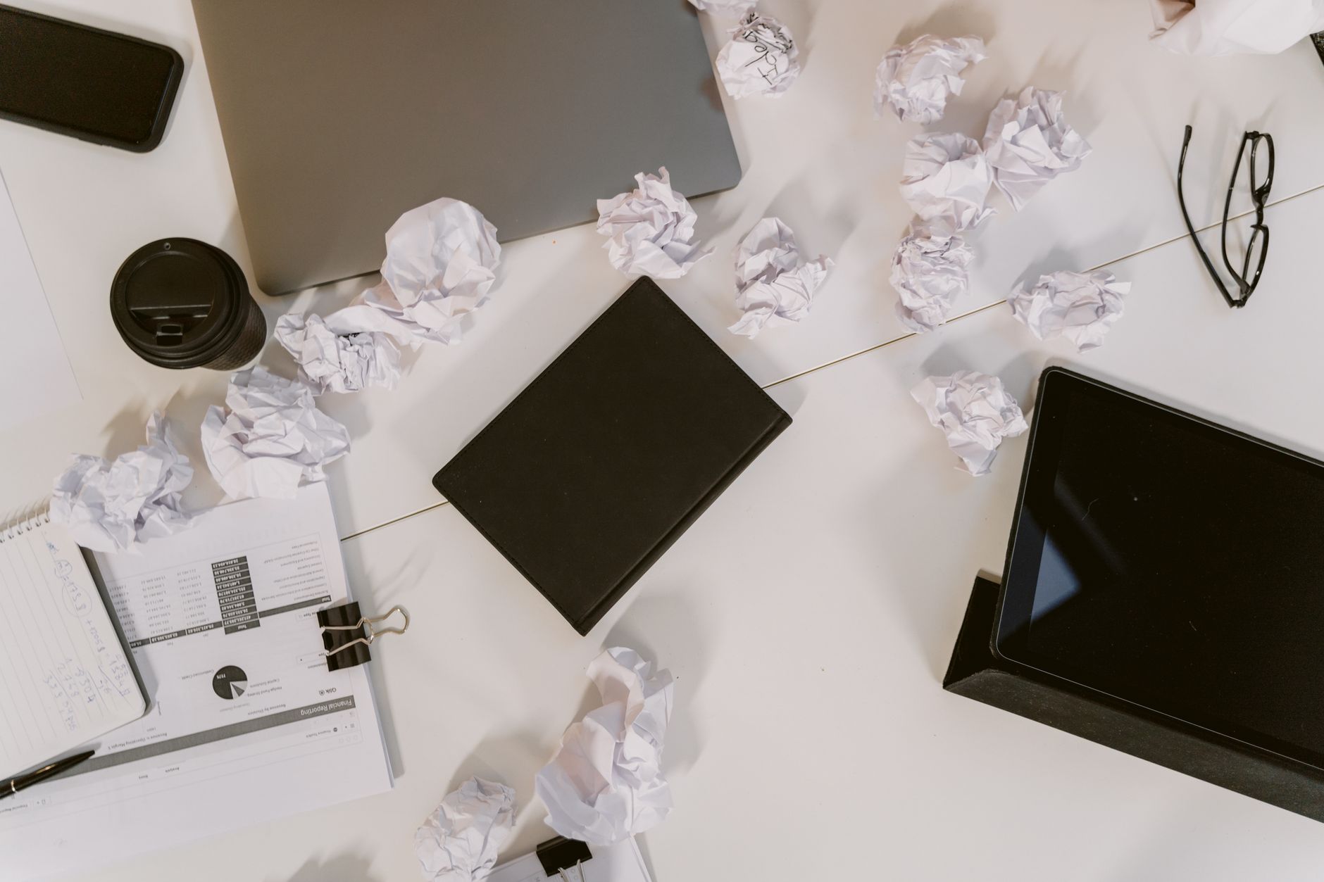 A tidy desk with a laptop and no paper documents, representing a digital filing system