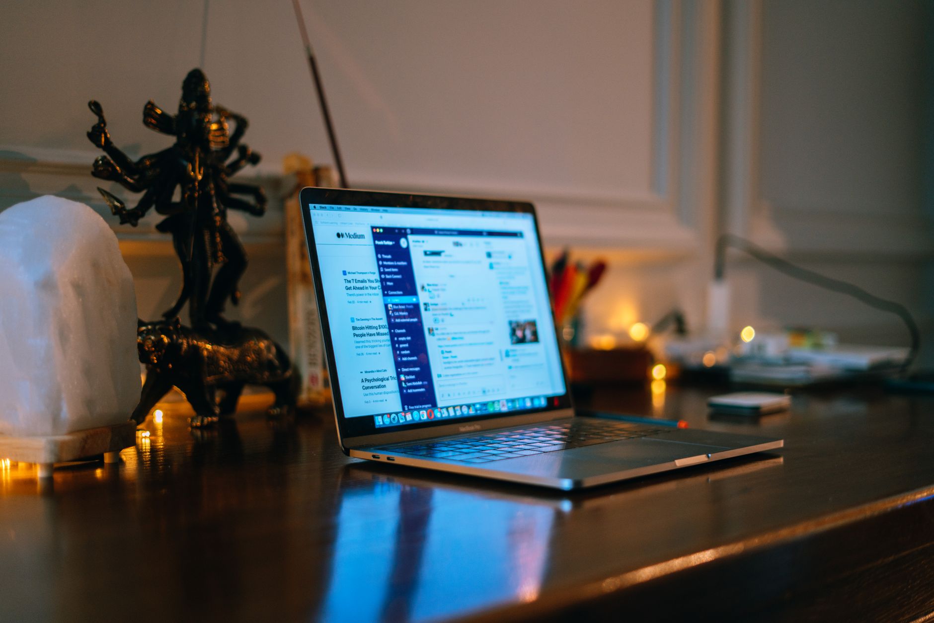 Person working on a laptop in a home office environment