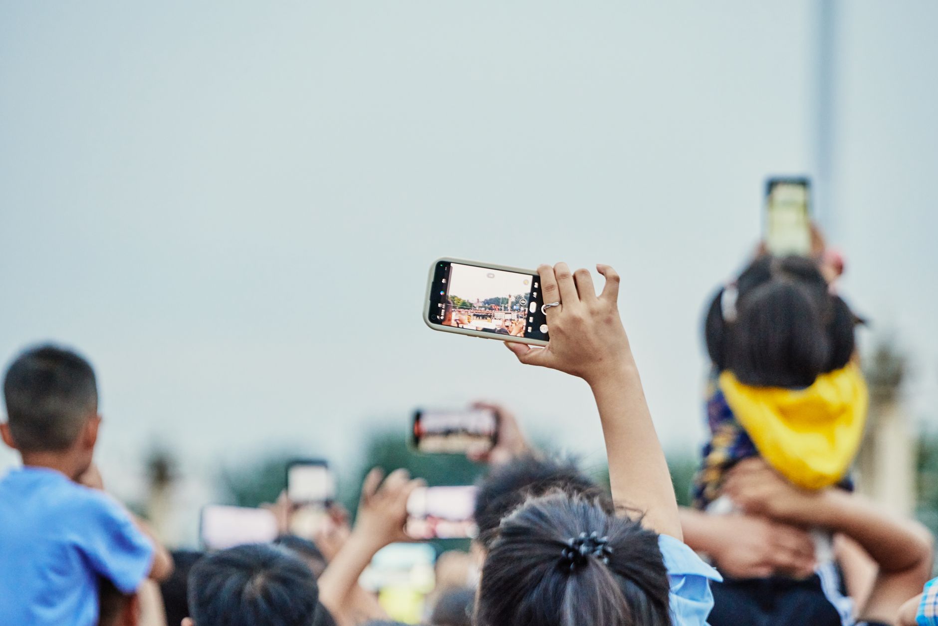 A smartphone syncing photos to a cloud or local backup service