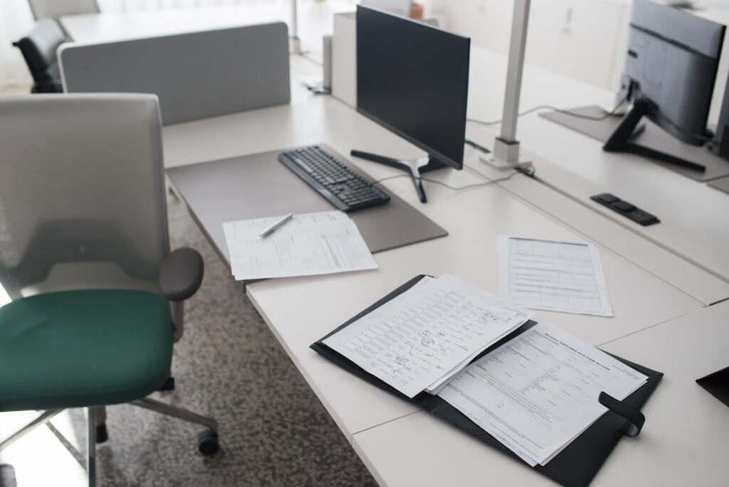 A document scanner on a home office desk ready to digitize paper files