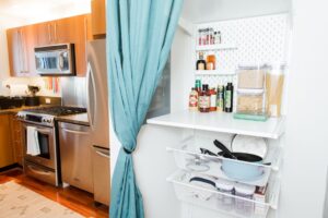 Organized kitchen pantry with labeled shelves and stocked food items