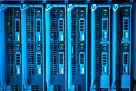 Server rack with blinking status lights representing self-hosted infrastructure monitoring