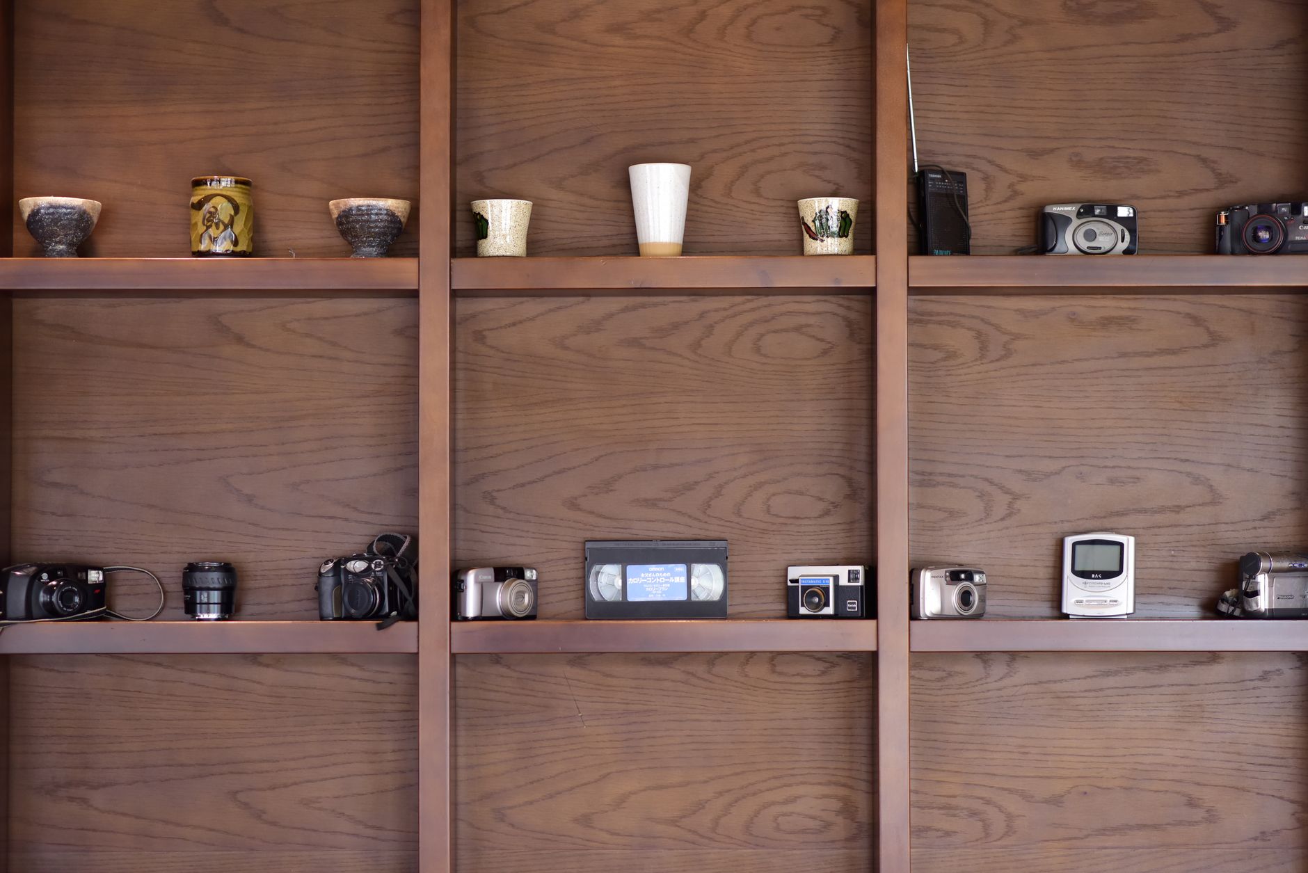 A neatly organized movie collection on shelves representing a managed media library