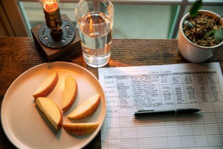 Set Up Mealie as a Self-Hosted Meal Planning Server Organized kitchen counter with meal planning notes and fresh ingredients