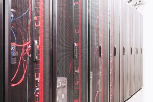 Set Up Vaultwarden as a Self-Hosted Bitwarden Password Manager A rack of servers in a data center representing self-hosted infrastructure