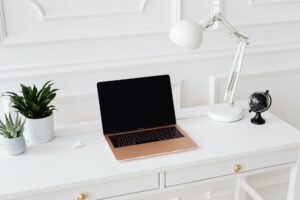 Set Up Actual Budget as a Self-Hosted Finance Tracker A tidy home office desk setup representing personal finance management at home