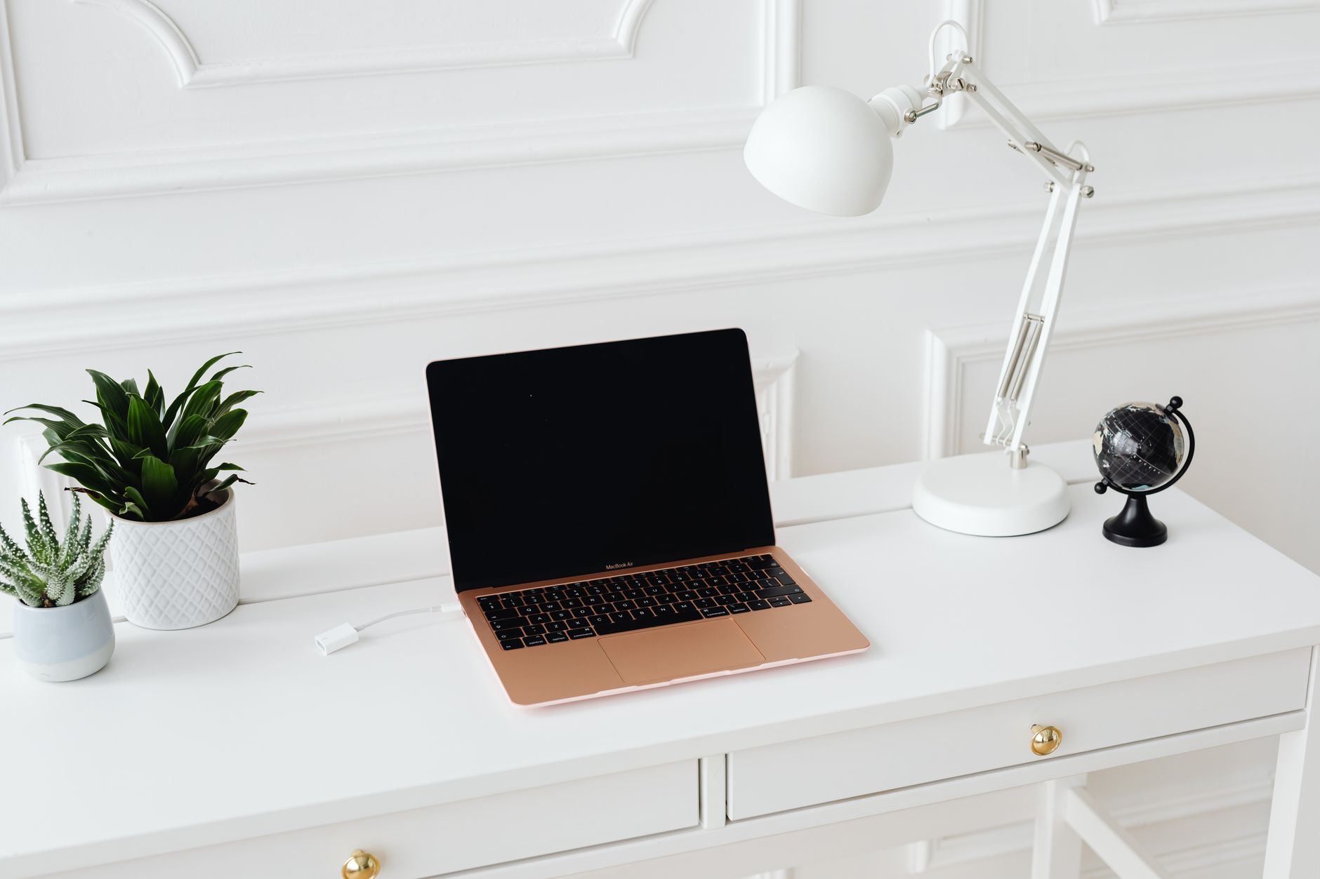 A tidy home office desk setup representing personal finance management at home