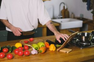 Set Up Mealie as a Self-Hosted Recipe and Meal Planner A tablet on a kitchen counter displaying a recipe app interface