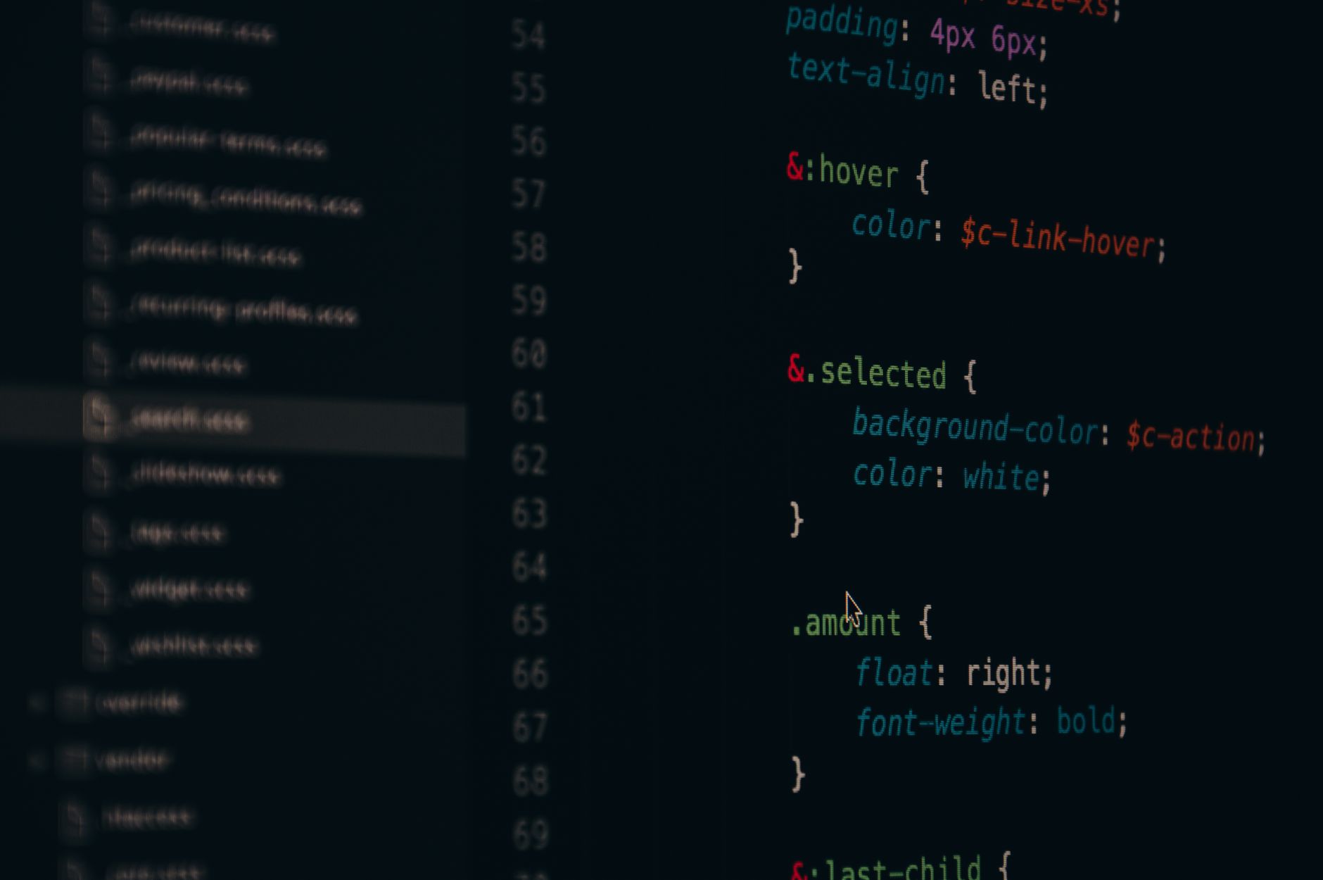 A text editor open on a monitor displaying configuration file code