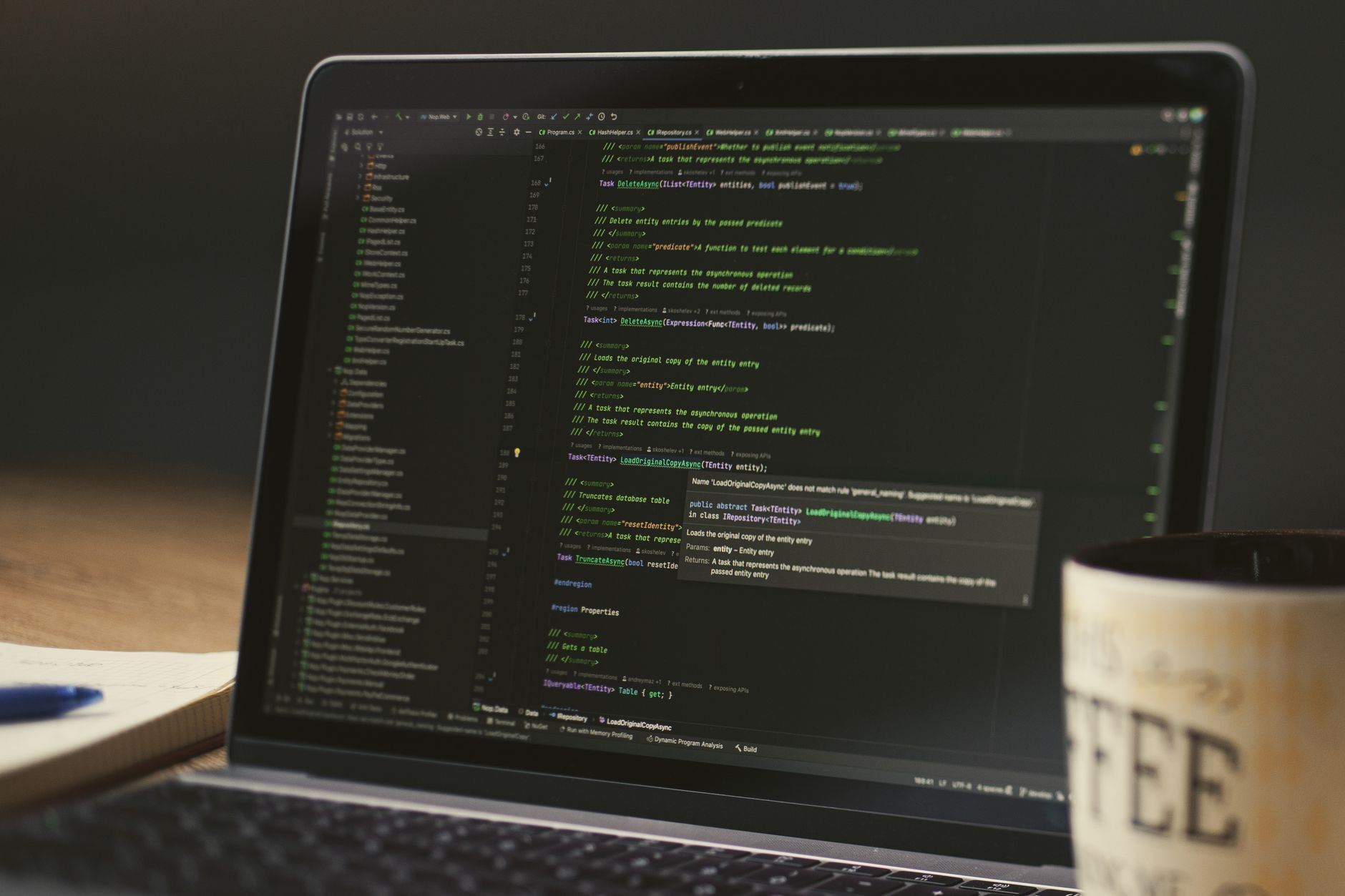 Developer editing a Docker Compose configuration file on a laptop